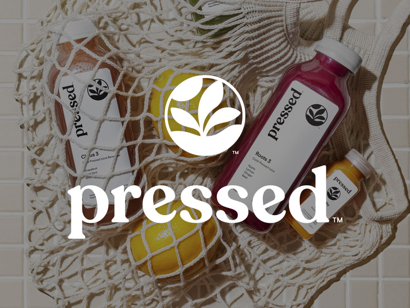 Decorative image showing the pressed logo on top of and images of fresh juices and lemons
