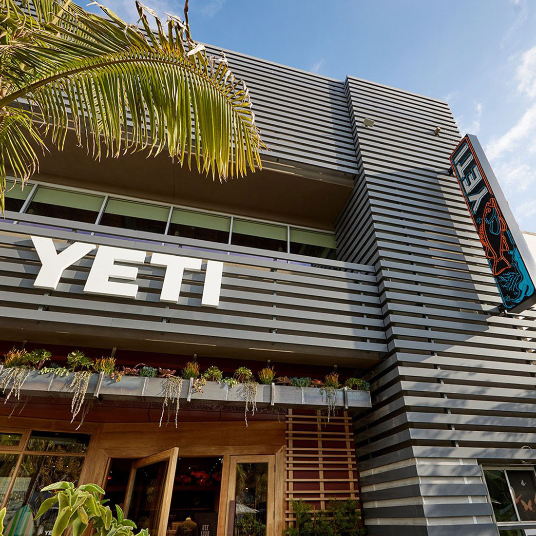 Photo outside the Yeti store in El Segundo with a gray wood slat exterior facade.